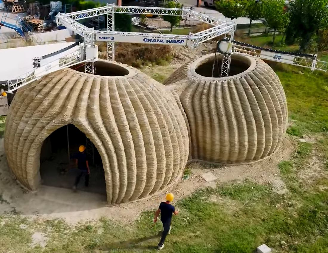 Two domed earthen houses printed from clay in Italy