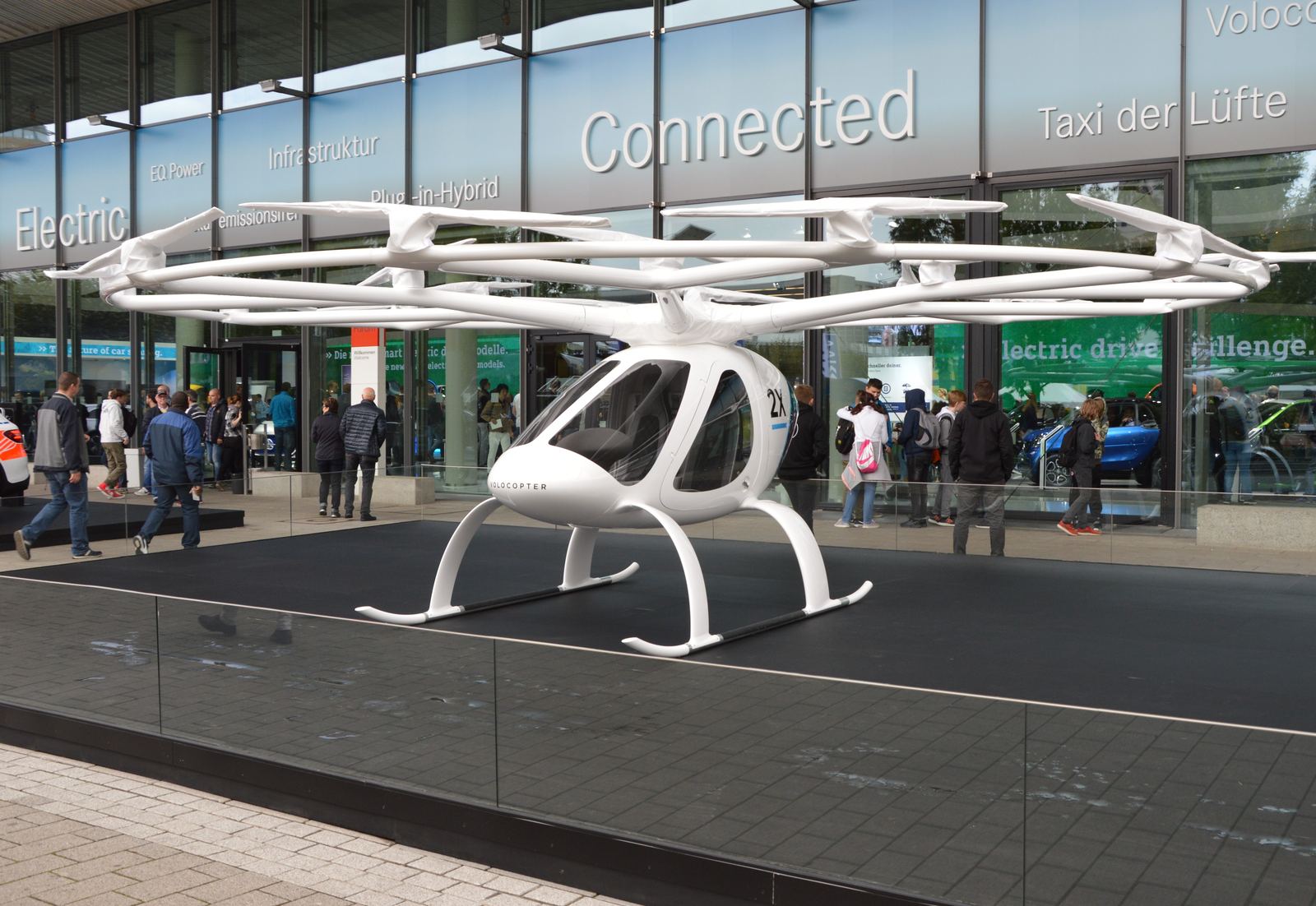 A two-seat Volocopter multicopter with a ring of small rotors on display
